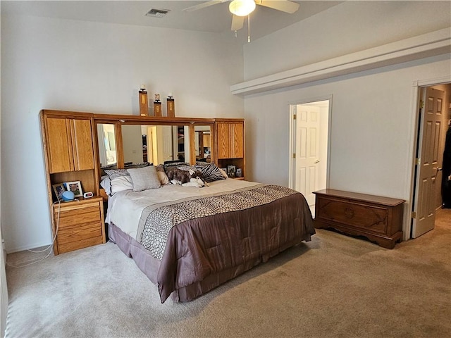 2084 E Crystal Dr, Fort Mohave, AZ 86426 - bedroom with light colored carpet, a towering ceiling, and french doors