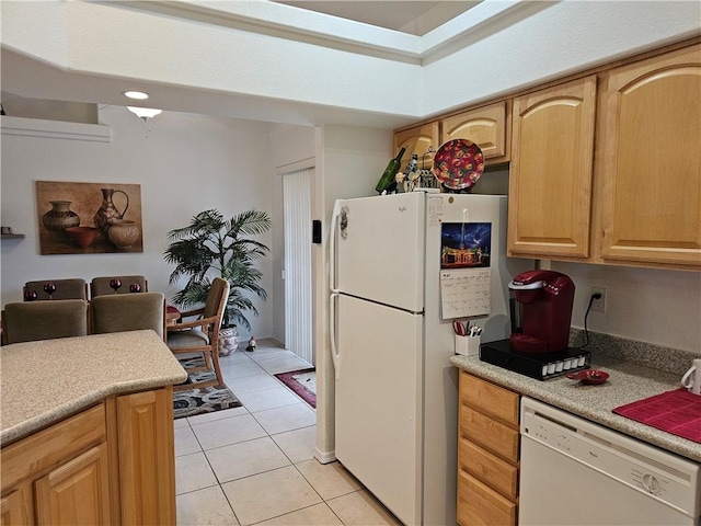 2084 E Crystal Dr, Fort Mohave, AZ 86426 - kitchen featuring white appliances, light tile patterned floors, light countertops, and light brown cabinets