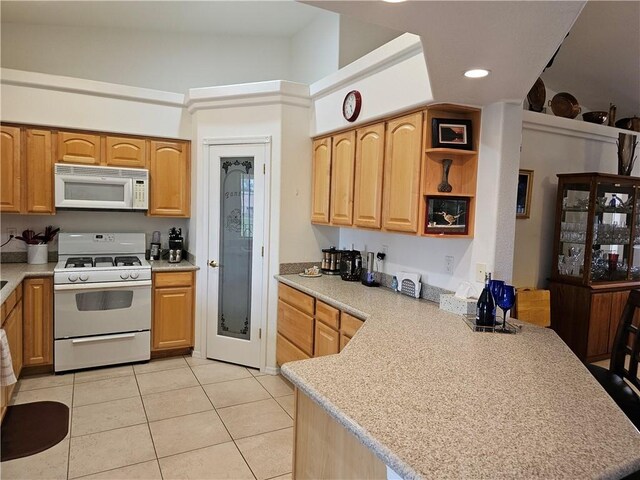 2084 E Crystal Dr, Fort Mohave, AZ 86426 - kitchen featuring white appliances, a peninsula, light tile patterned floors, light countertops, and recessed lighting