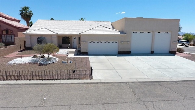2084 E Crystal Dr, Fort Mohave, AZ 86426 - view of front of property featuring a garage, stucco siding, concrete driveway, and a tiled roof
