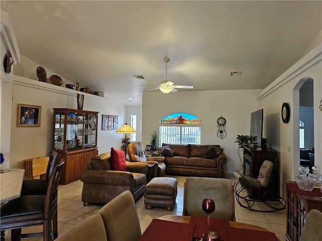 2084 E Crystal Dr, Fort Mohave, AZ 86426 - living room with light tile patterned floors, arched walkways, and ceiling fan