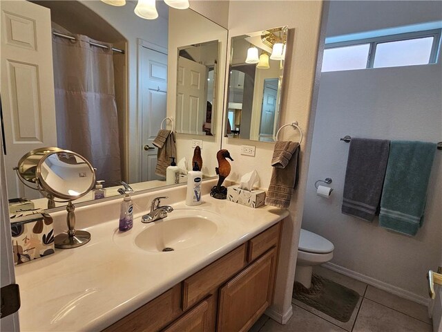 2084 E Crystal Dr, Fort Mohave, AZ 86426 - bathroom with toilet, tile patterned floors, vanity, a shower with shower curtain, and baseboards