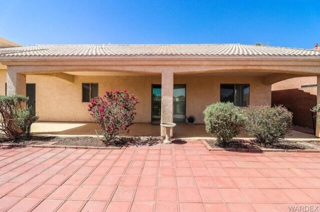 2084 E Crystal Dr, Fort Mohave, AZ 86426 - rear view of property with stucco siding and a patio area