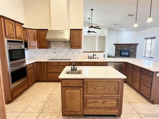 kitchen with backsplash, stainless steel appliances, and a sink