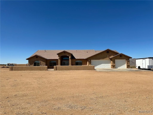 single story home with fence, a tiled roof, stucco siding, driveway, and a garage