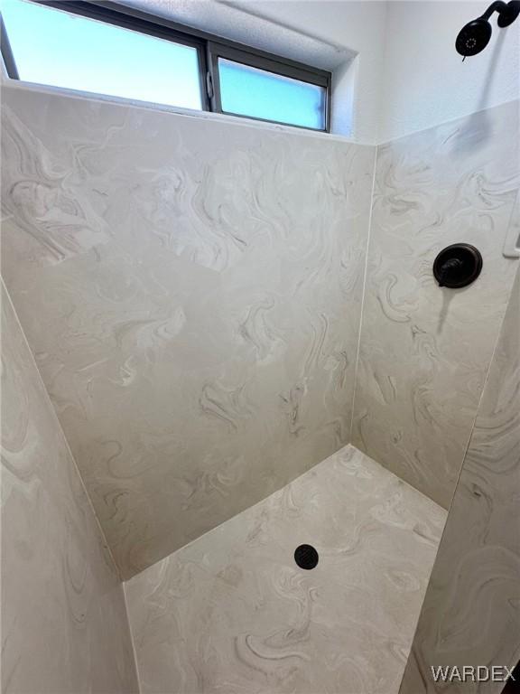 bathroom featuring a shower