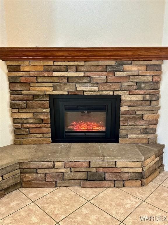 interior details with a stone fireplace