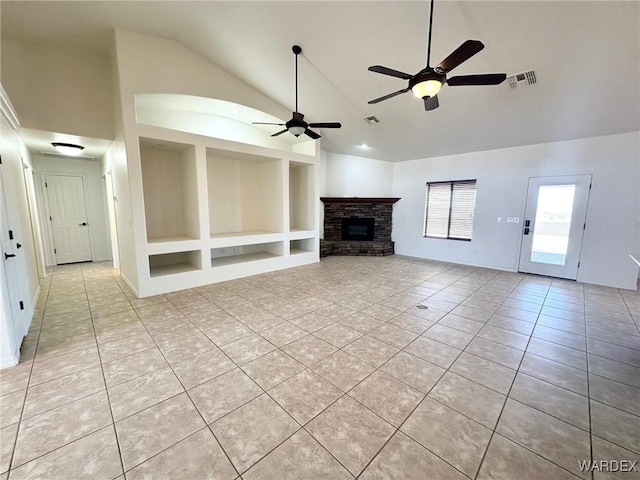 unfurnished living room featuring a ceiling fan, light tile patterned flooring, built in features, a fireplace, and visible vents