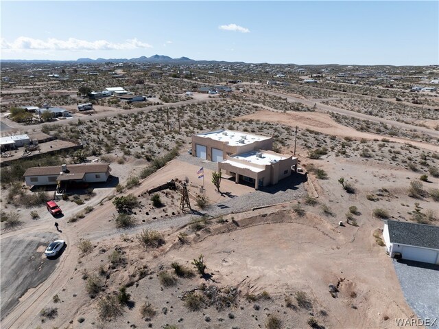 birds eye view of property with a desert view and a mountain view