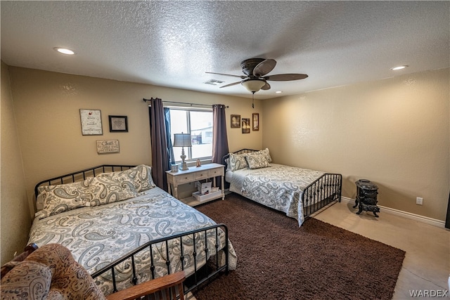 bedroom featuring a textured ceiling, recessed lighting, a ceiling fan, visible vents, and baseboards