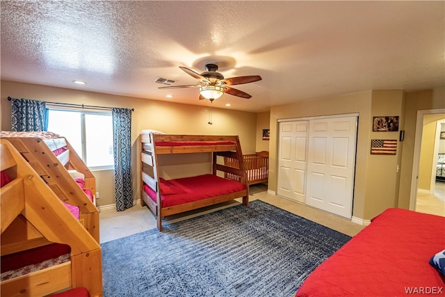 bedroom featuring baseboards, visible vents, a textured ceiling, and recessed lighting