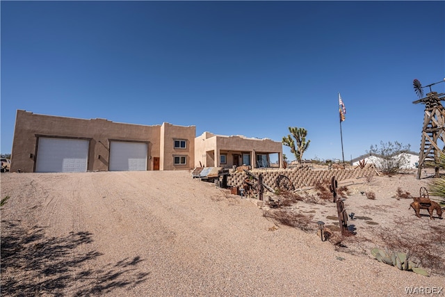 adobe home featuring driveway