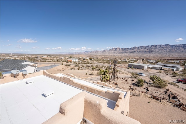 birds eye view of property with a mountain view