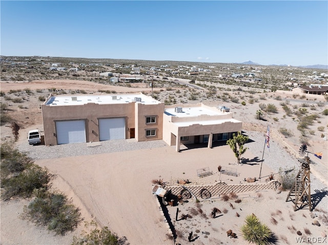 birds eye view of property featuring view of desert