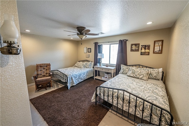 bedroom with recessed lighting, visible vents, a textured wall, ceiling fan, and a textured ceiling