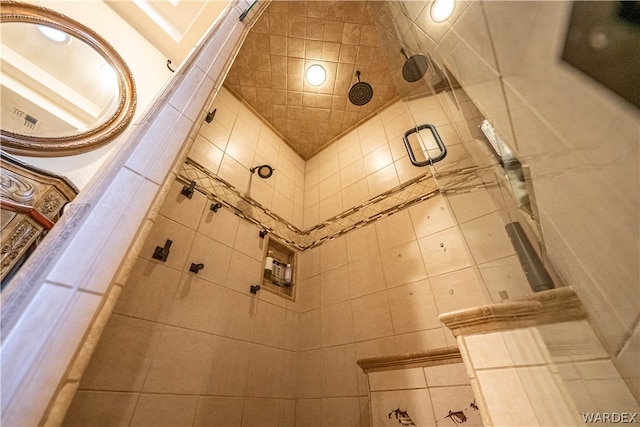 full bathroom with a tile shower