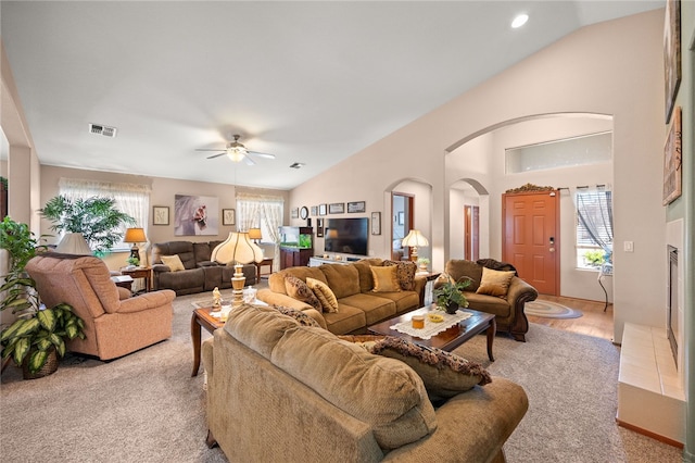 3854 Heather Ave, Kingman, AZ 86401 - living room featuring vaulted ceiling, arched walkways, ceiling fan, light colored carpet, and recessed lighting