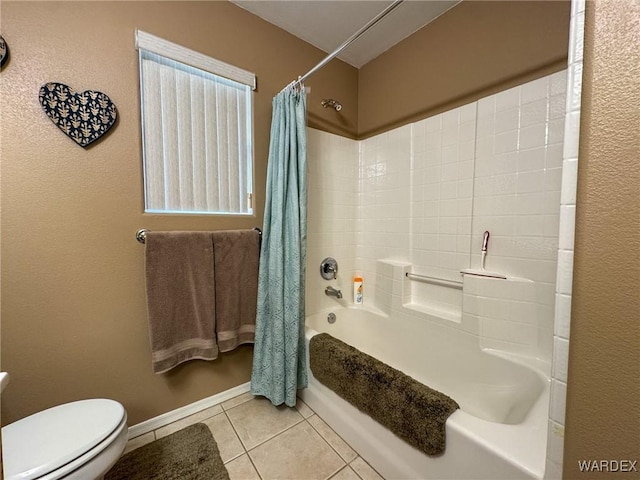 bathroom with toilet, tile patterned flooring, and shower / bath combo