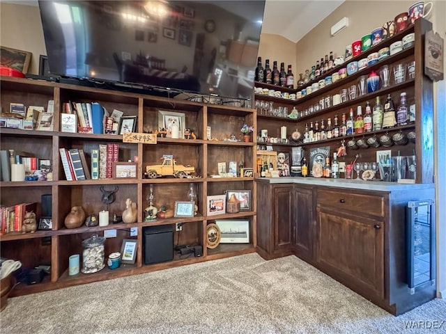 interior space with lofted ceiling and carpet floors