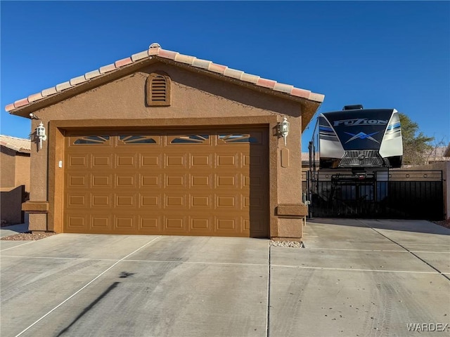 garage featuring driveway