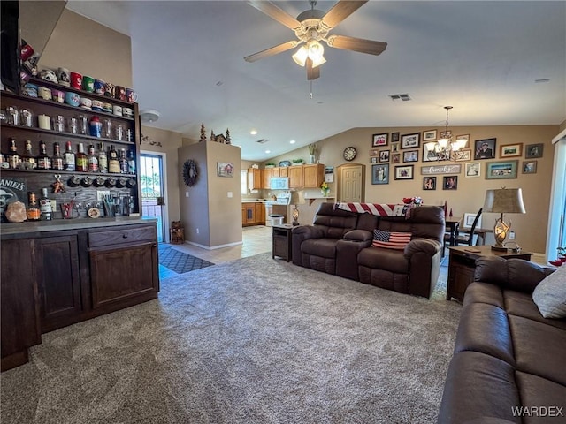 living area with lofted ceiling, light carpet, ceiling fan with notable chandelier, visible vents, and baseboards