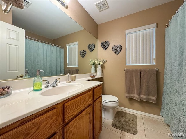 bathroom with tile patterned flooring, visible vents, vanity, and toilet