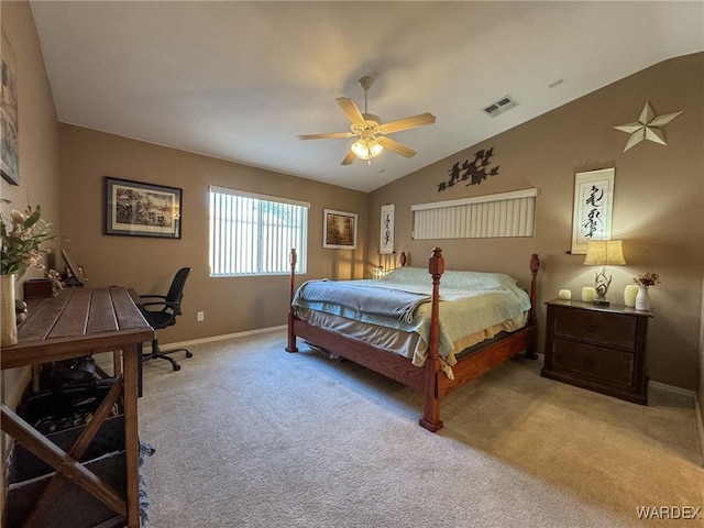 bedroom featuring light colored carpet, a ceiling fan, baseboards, vaulted ceiling, and visible vents