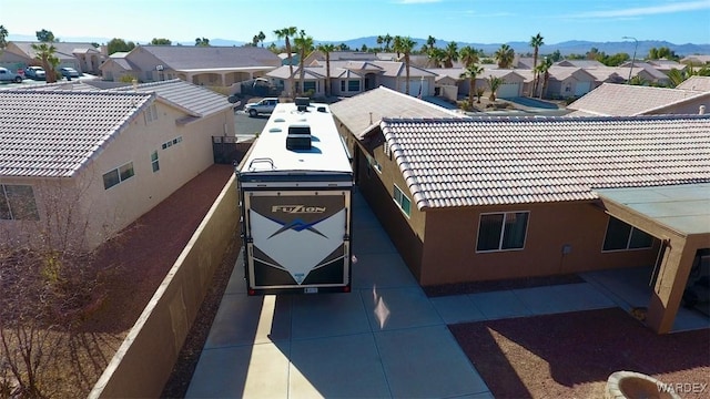 exterior space with a residential view and a mountain view