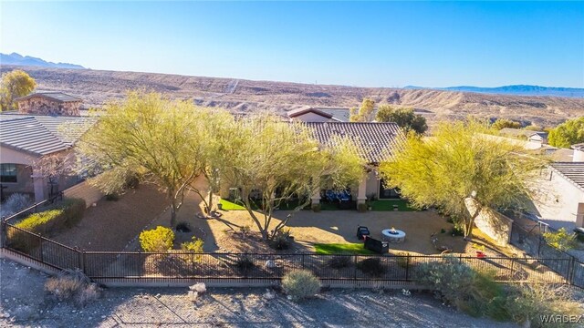 birds eye view of property with a mountain view