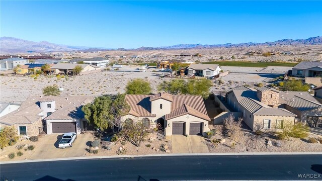 bird's eye view with a residential view and a mountain view