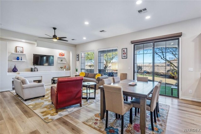 dining area featuring light wood-style floors, recessed lighting, visible vents, and baseboards