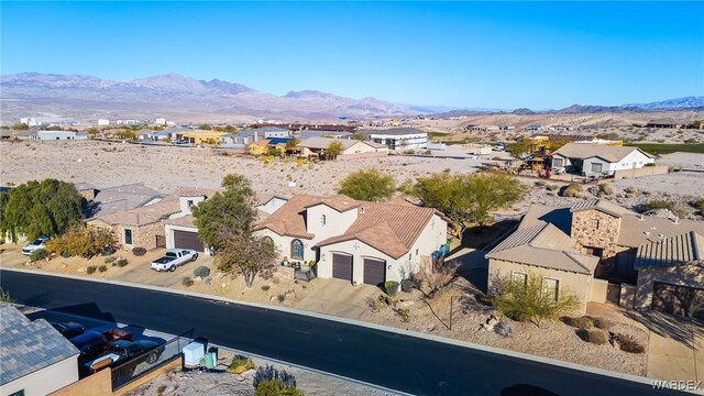 drone / aerial view with a residential view and a mountain view