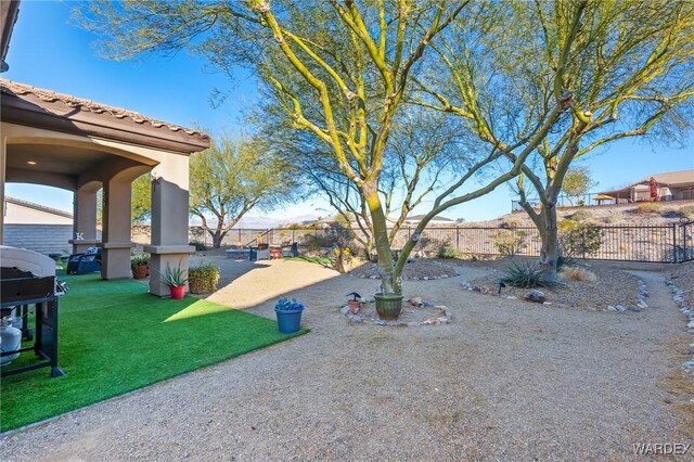 view of yard featuring a patio area and a fenced backyard