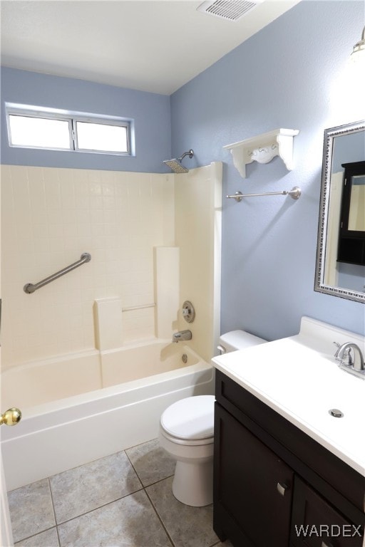 bathroom with tile patterned flooring, bathing tub / shower combination, toilet, and vanity