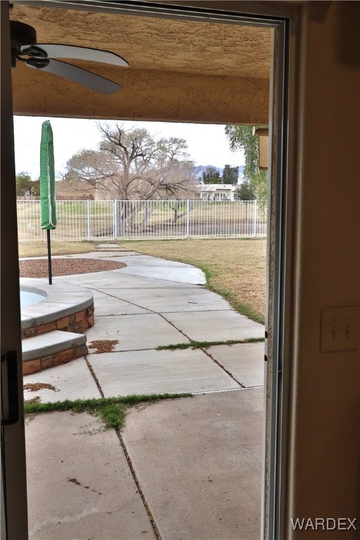 view of patio / terrace featuring a ceiling fan and fence