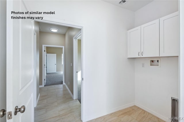 laundry room with washer hookup, visible vents, cabinet space, and baseboards