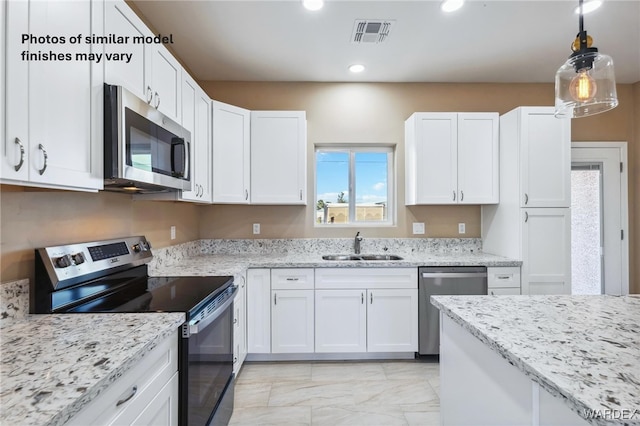 kitchen with white cabinets, visible vents, stainless steel appliances, and a sink