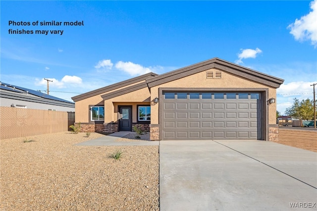 view of front facade with a garage, fence, stone siding, driveway, and stucco siding