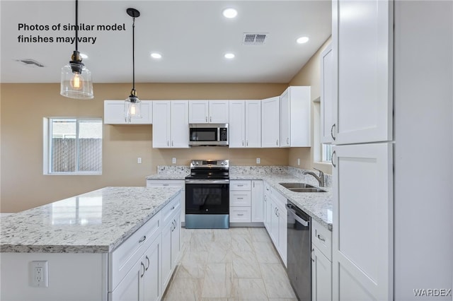 kitchen with a center island, stainless steel appliances, hanging light fixtures, white cabinets, and a sink