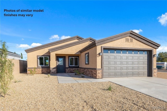 ranch-style home with driveway, a garage, stone siding, fence, and stucco siding