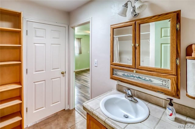 bathroom with tile patterned flooring and vanity