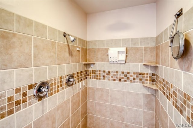 bathroom with a tile shower