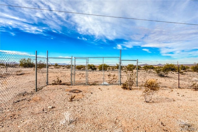 view of yard featuring a gate and fence