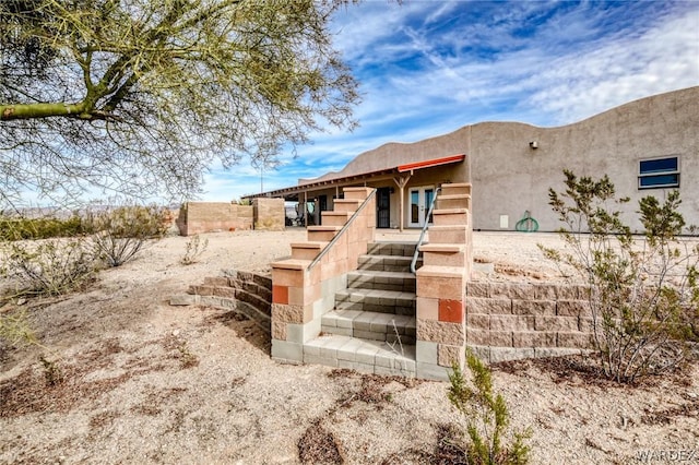 exterior space featuring stucco siding