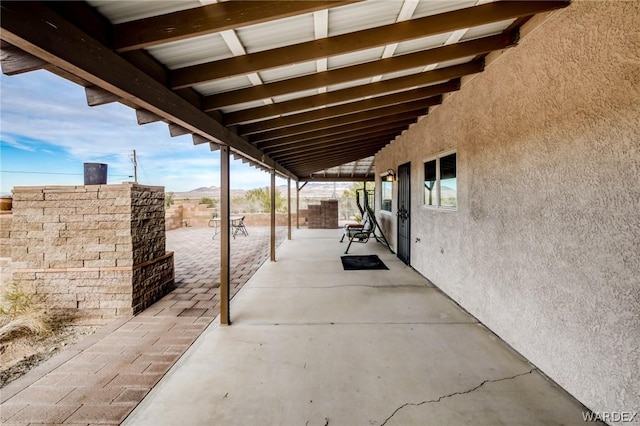 view of patio / terrace featuring fence