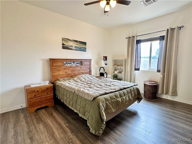 bedroom with dark wood-style floors, visible vents, baseboards, and a ceiling fan