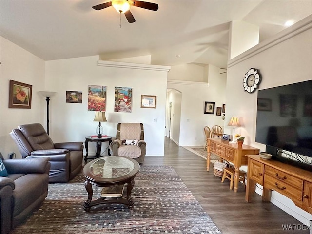 living room featuring lofted ceiling, dark wood-style floors, arched walkways, and a ceiling fan