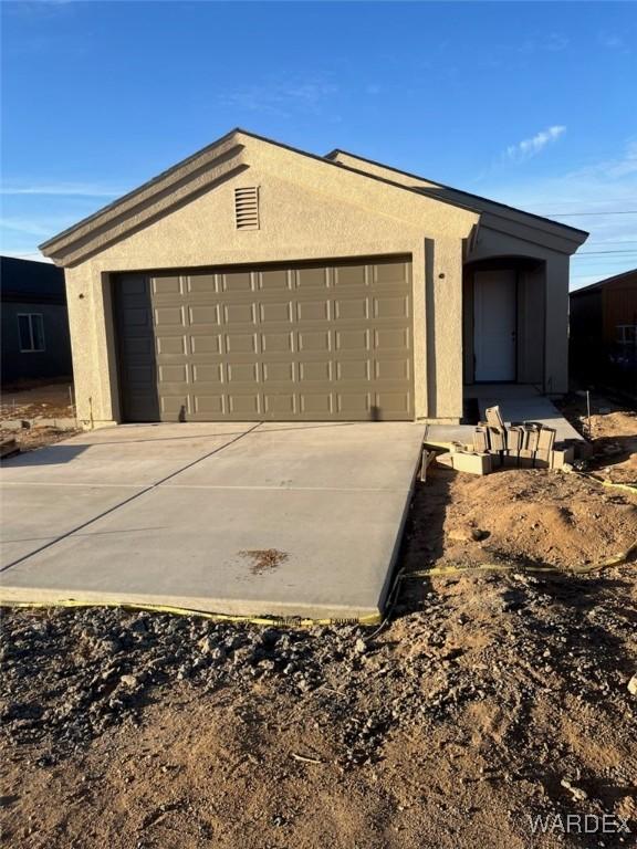 garage featuring driveway