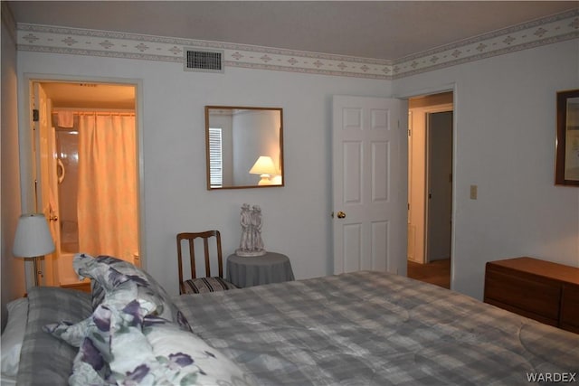 bedroom featuring visible vents