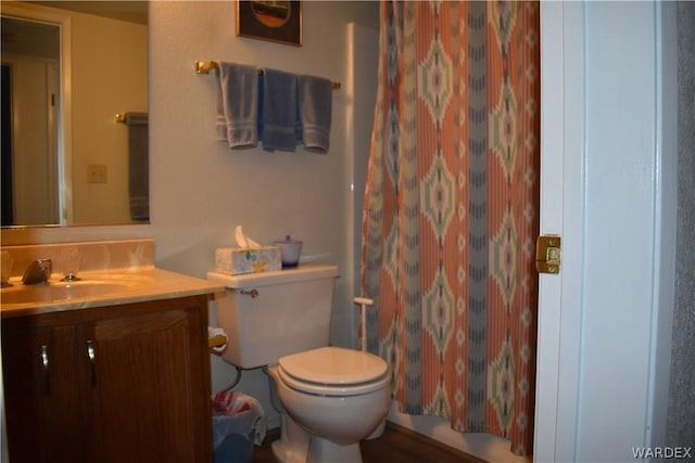 full bathroom with vanity, toilet, and a shower with curtain